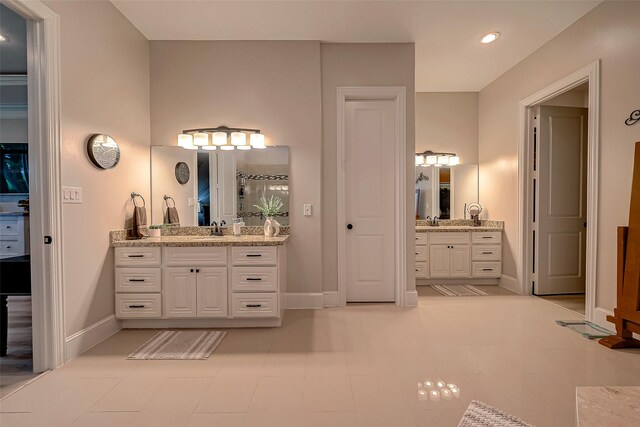 bathroom with tile patterned flooring and vanity