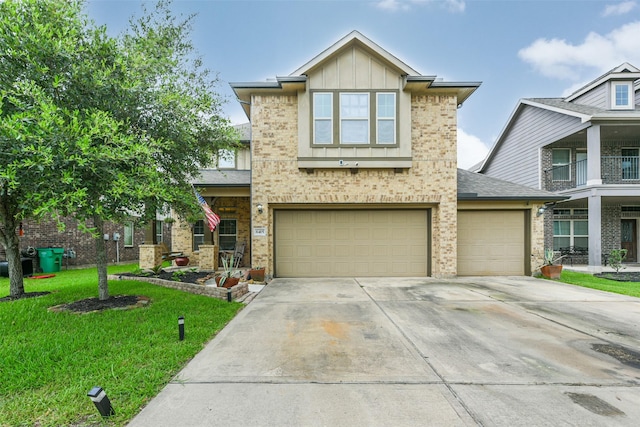 view of front of property with a front lawn and a garage