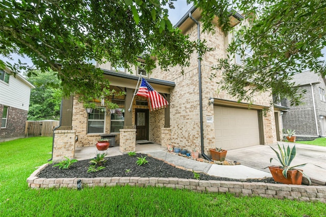 view of front of home featuring a garage and a front yard