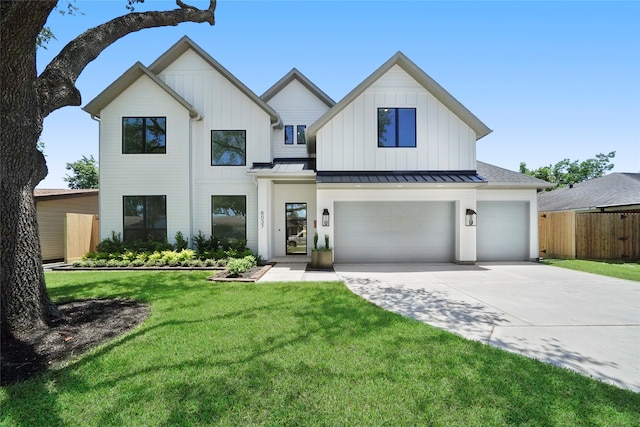 modern farmhouse featuring a garage and a front yard