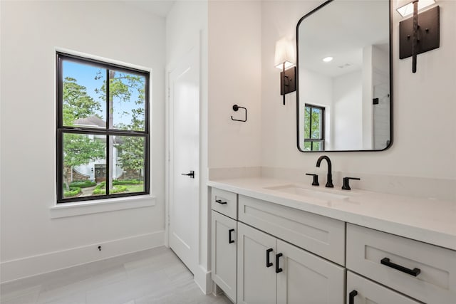 bathroom with tile patterned floors and vanity