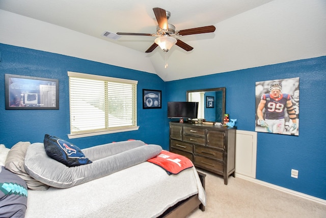 bedroom featuring ceiling fan, light colored carpet, and lofted ceiling