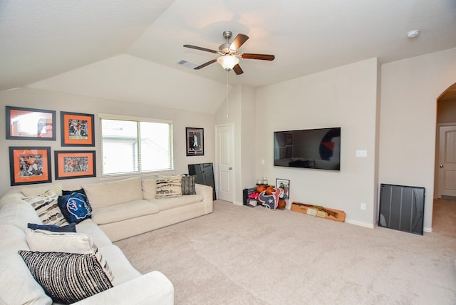 living room with ceiling fan, light colored carpet, and vaulted ceiling