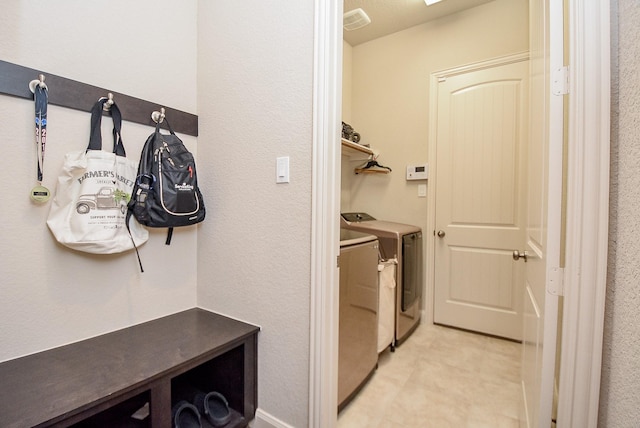 laundry room with separate washer and dryer