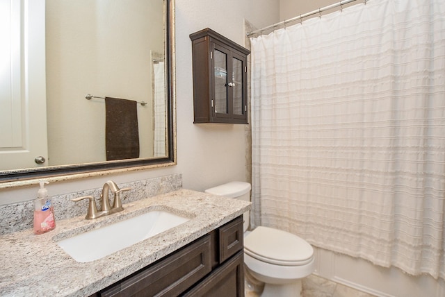 full bathroom featuring shower / bath combination with curtain, vanity, and toilet