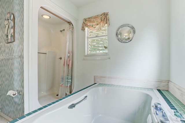 bathroom with a tub to relax in