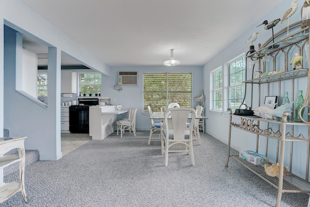 carpeted dining space featuring a wall mounted air conditioner