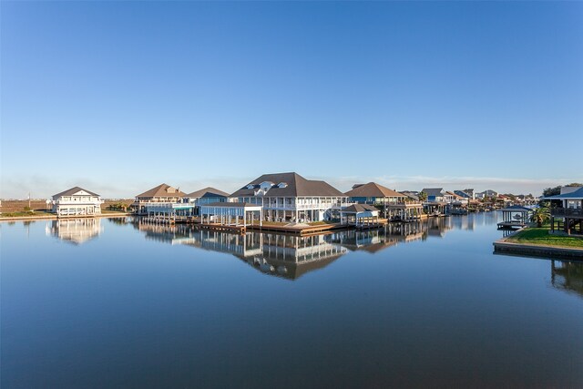 1295 Lagoon Dr, Crystal Beach, TX 77650 - dock with a water view and a residential view