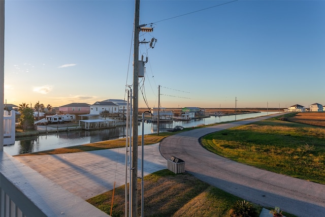1295 Lagoon Dr, Crystal Beach, TX 77650 - view of property's community featuring a water view and a dock