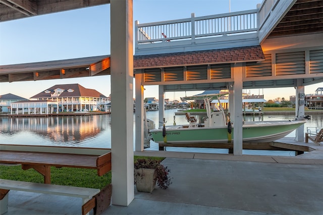 view of home's community featuring a water view and a dock