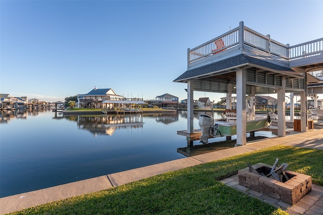 view of dock featuring a fire pit and a water view