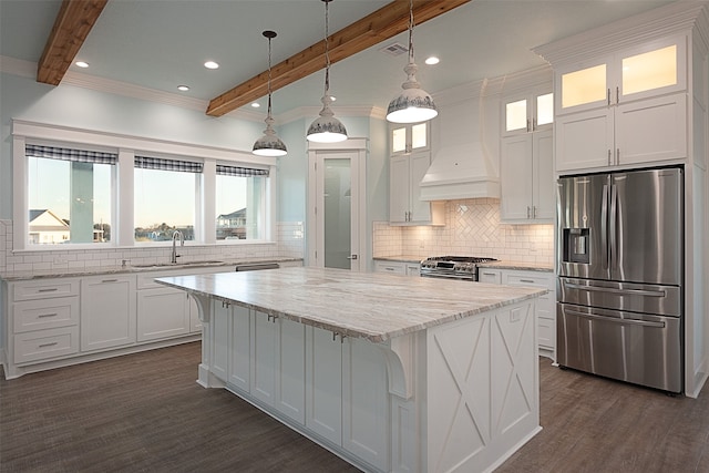 kitchen featuring dark hardwood / wood-style flooring, custom exhaust hood, appliances with stainless steel finishes, decorative backsplash, and pendant lighting