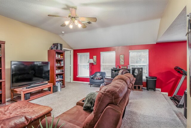 living room featuring carpet flooring, ceiling fan, a textured ceiling, and lofted ceiling