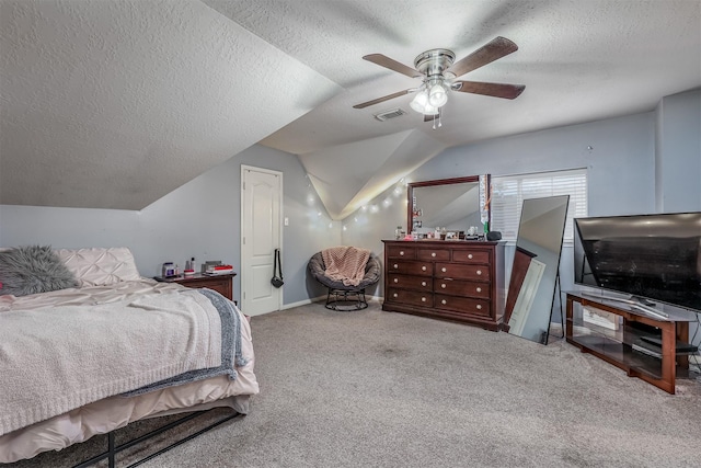 bedroom with a textured ceiling, carpet floors, ceiling fan, and lofted ceiling