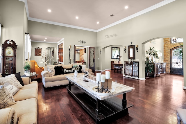 living room with dark hardwood / wood-style flooring and crown molding