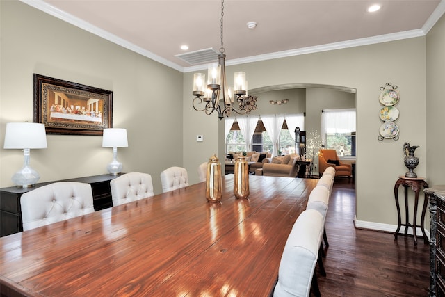 dining area with ornamental molding, dark hardwood / wood-style flooring, and a notable chandelier