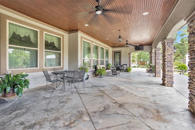 view of patio / terrace with a ceiling fan and outdoor dining space