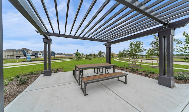 view of property's community with a yard, a pergola, and a patio