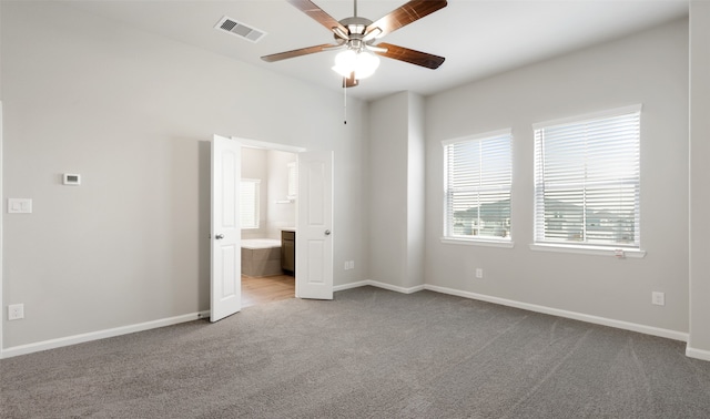 carpeted empty room featuring ceiling fan