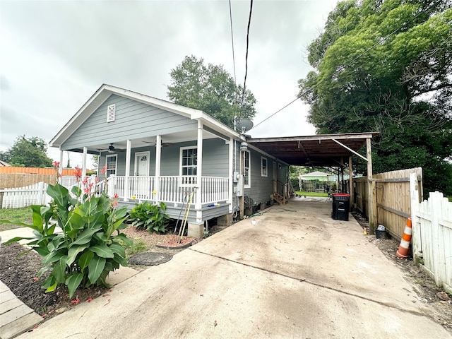 bungalow-style house with a carport and covered porch