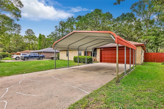 view of parking / parking lot with a carport, a garage, and a yard