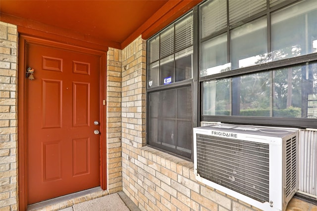 doorway to property featuring cooling unit