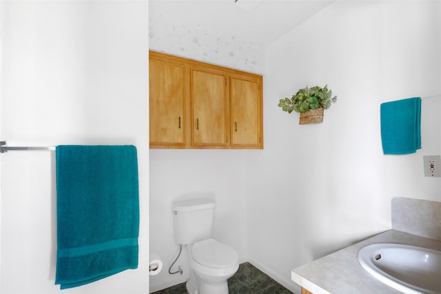 bathroom with vanity and toilet