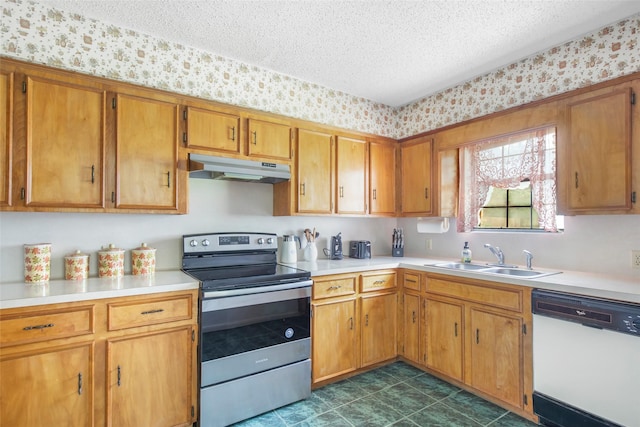 kitchen featuring a textured ceiling, dishwasher, sink, and stainless steel range with electric cooktop