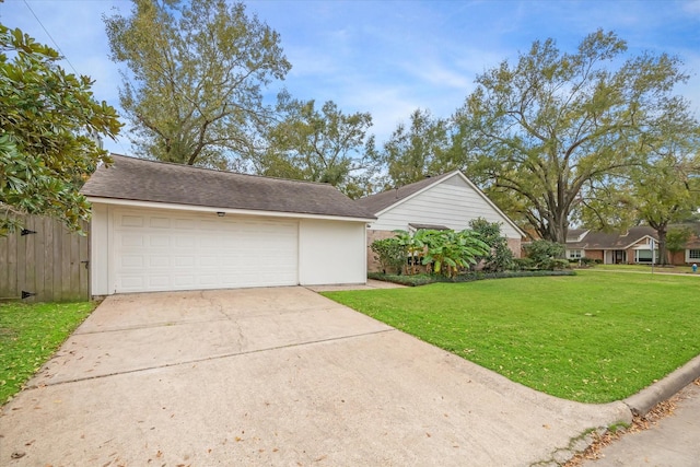 exterior space with a garage and a front yard