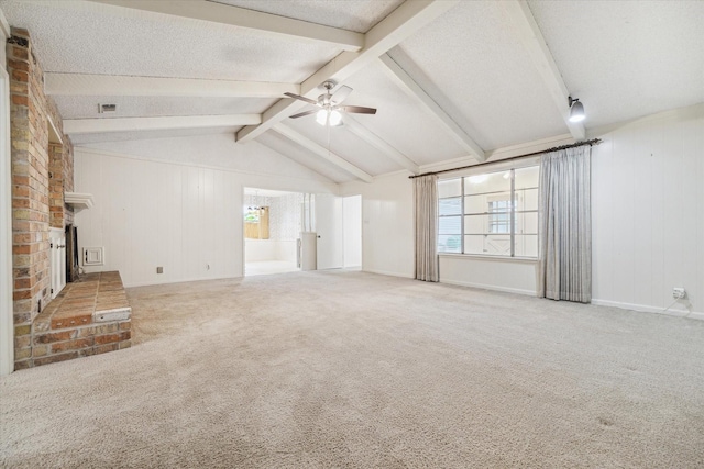 unfurnished living room with a textured ceiling, vaulted ceiling with beams, carpet floors, and ceiling fan