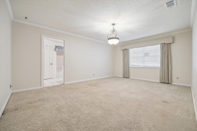 carpeted empty room with a textured ceiling and crown molding