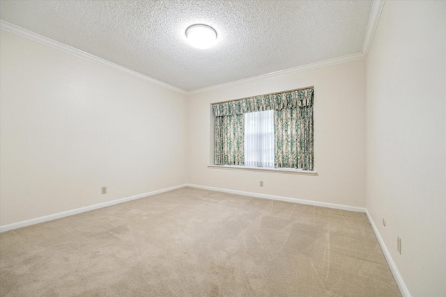 carpeted spare room with a textured ceiling and crown molding