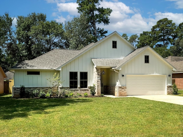 view of front of home featuring a garage and a front lawn