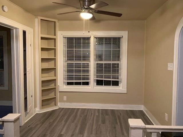 3205 Illinois St, Baytown, TX 77520 - unfurnished room with dark wood-style floors, a ceiling fan, arched walkways, and a smoke detector