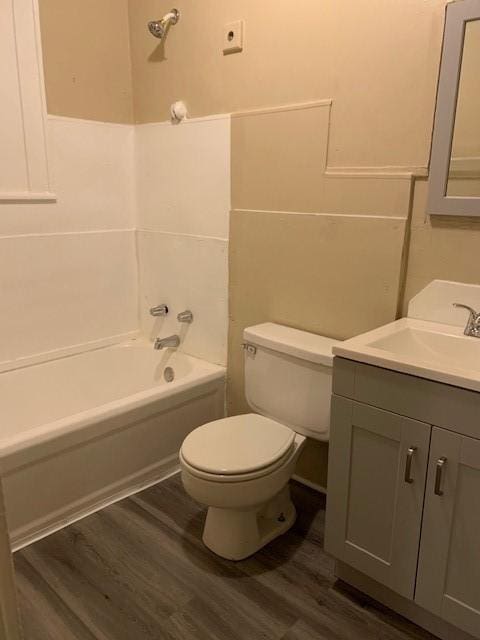 3205 Illinois St, Baytown, TX 77520 - full bath featuring wood finished floors, vanity, and bathtub / shower combination