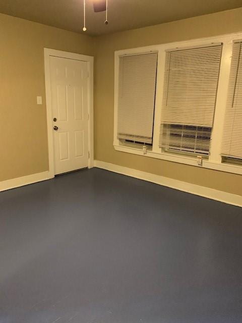 3205 Illinois St, Baytown, TX 77520 - unfurnished room featuring finished concrete flooring and ceiling fan