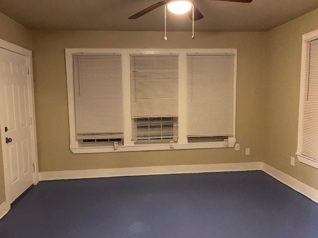 unfurnished room featuring ceiling fan