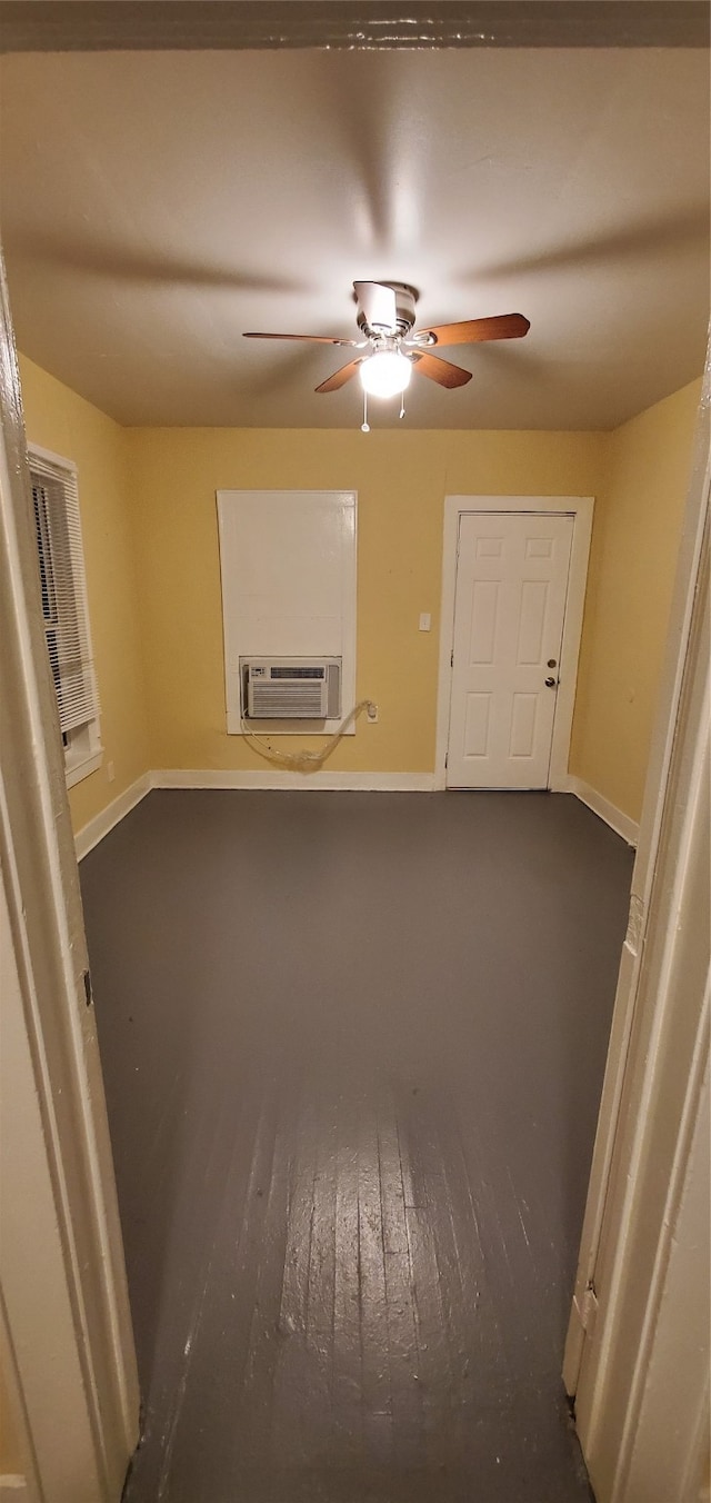 empty room with cooling unit and ceiling fan