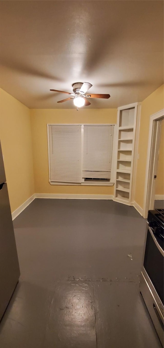 3205 Illinois St, Baytown, TX 77520 - spare room with a ceiling fan and finished concrete floors