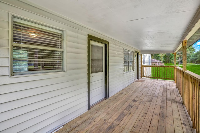 wooden terrace with a porch