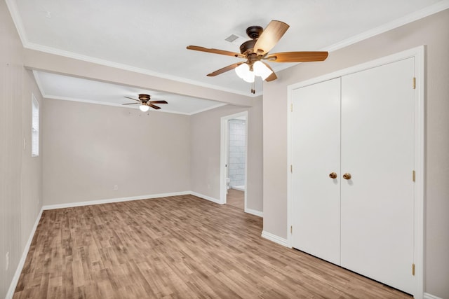 unfurnished bedroom with crown molding, ceiling fan, and light hardwood / wood-style flooring