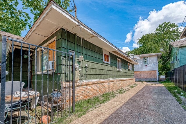 view of side of home featuring a patio