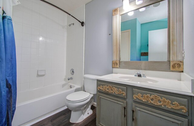 full bathroom with hardwood / wood-style floors, vanity, toilet, and shower / bathtub combination with curtain