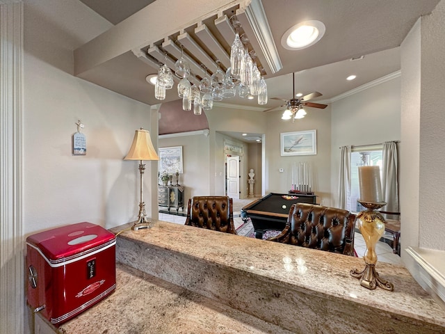 interior space with crown molding, ceiling fan with notable chandelier, and pool table