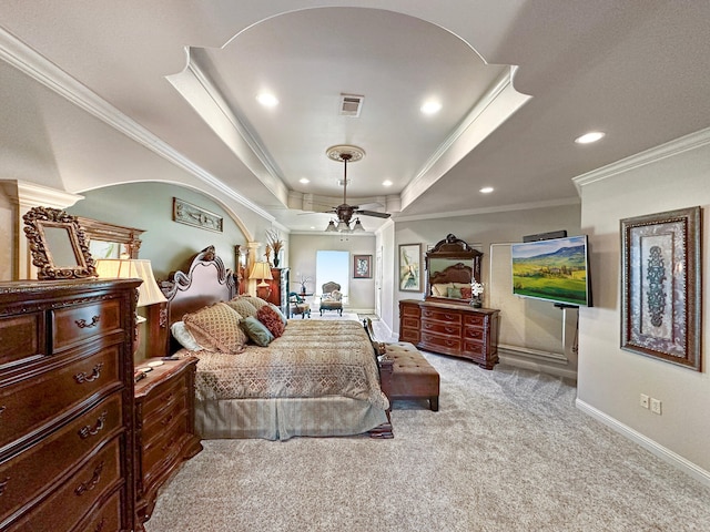 bedroom featuring light carpet, ceiling fan, a raised ceiling, and ornamental molding