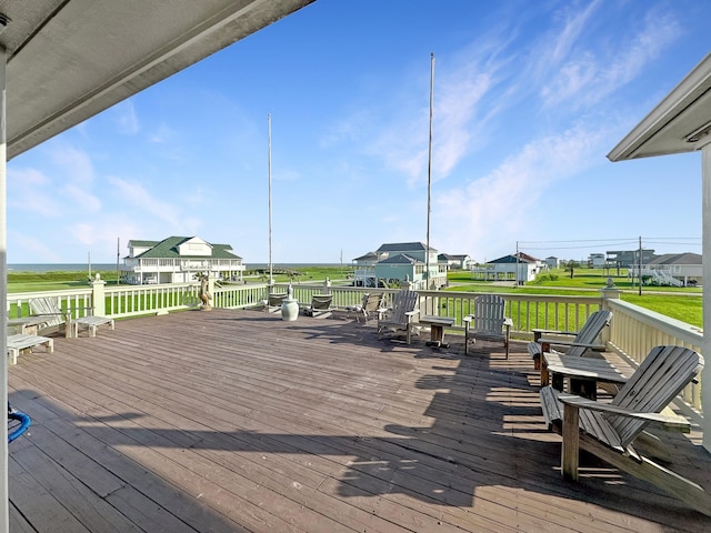 wooden terrace with a lawn