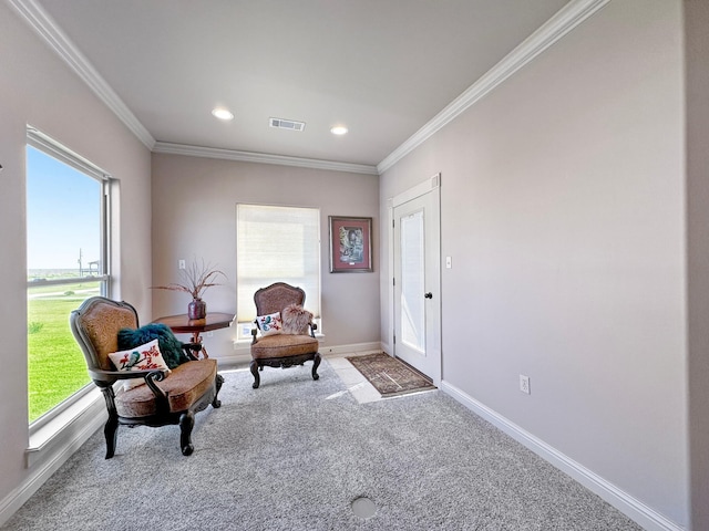 sitting room featuring ornamental molding, visible vents, carpet floors, and baseboards