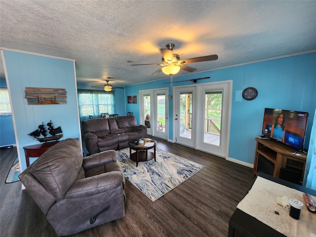 living room featuring dark hardwood / wood-style floors, a textured ceiling, french doors, and ceiling fan