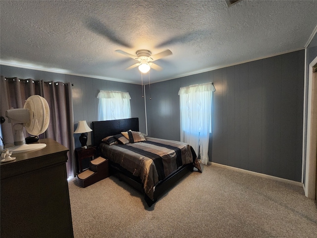 bedroom featuring carpet flooring, multiple windows, and ceiling fan