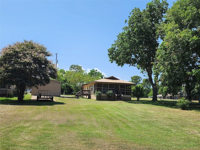 view of yard with a sunroom